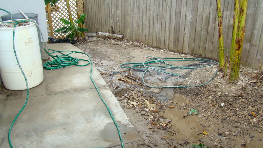 UNUSEABLE AREA AT SIDE OF HOUSE